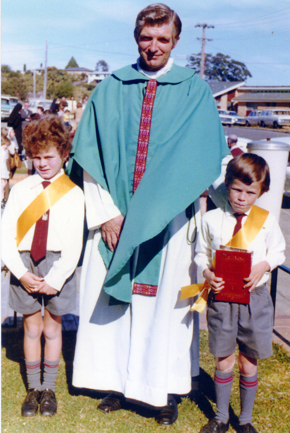 Danny Plunkett and Jim O'Gorman with Father Tony Casey at St Augustine's First Communion, 1974