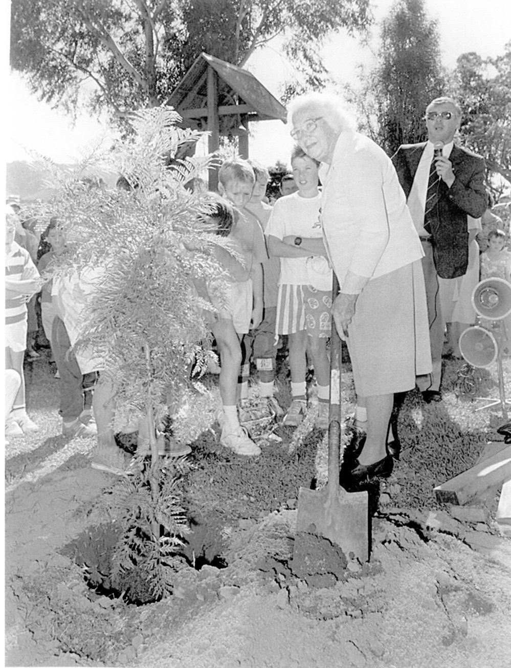 Loretto Carmichael planting a tree on the 75th anniversary of St Augustine's School, April 1988