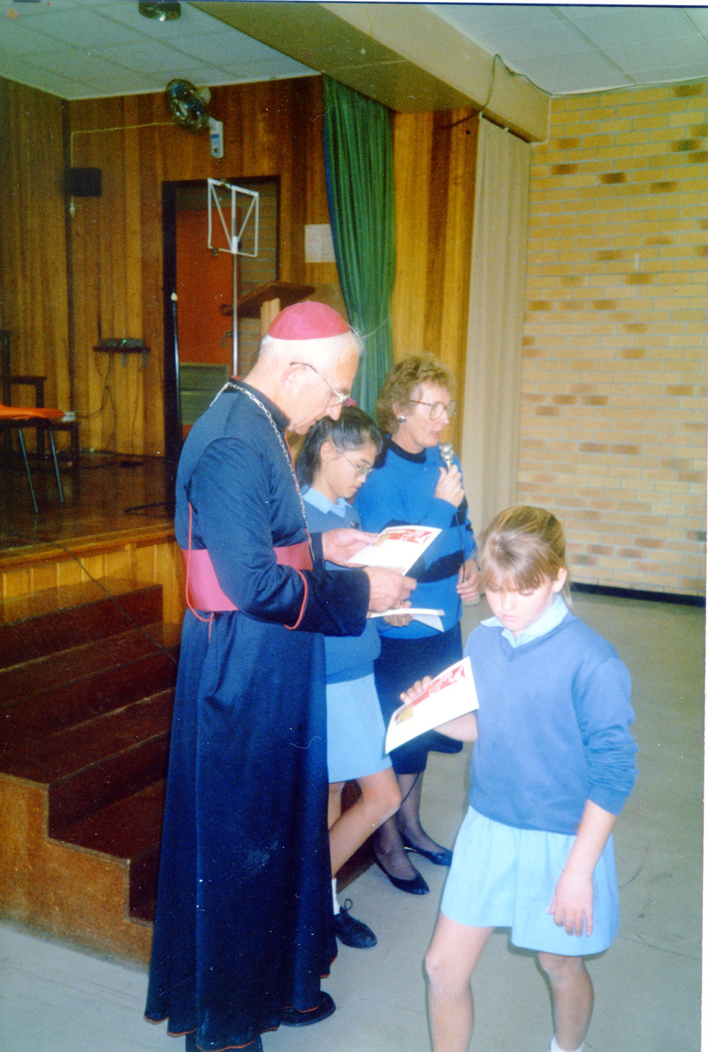 Father Casey presenting certificates to students at St Augustine's Convent School, 1990s 