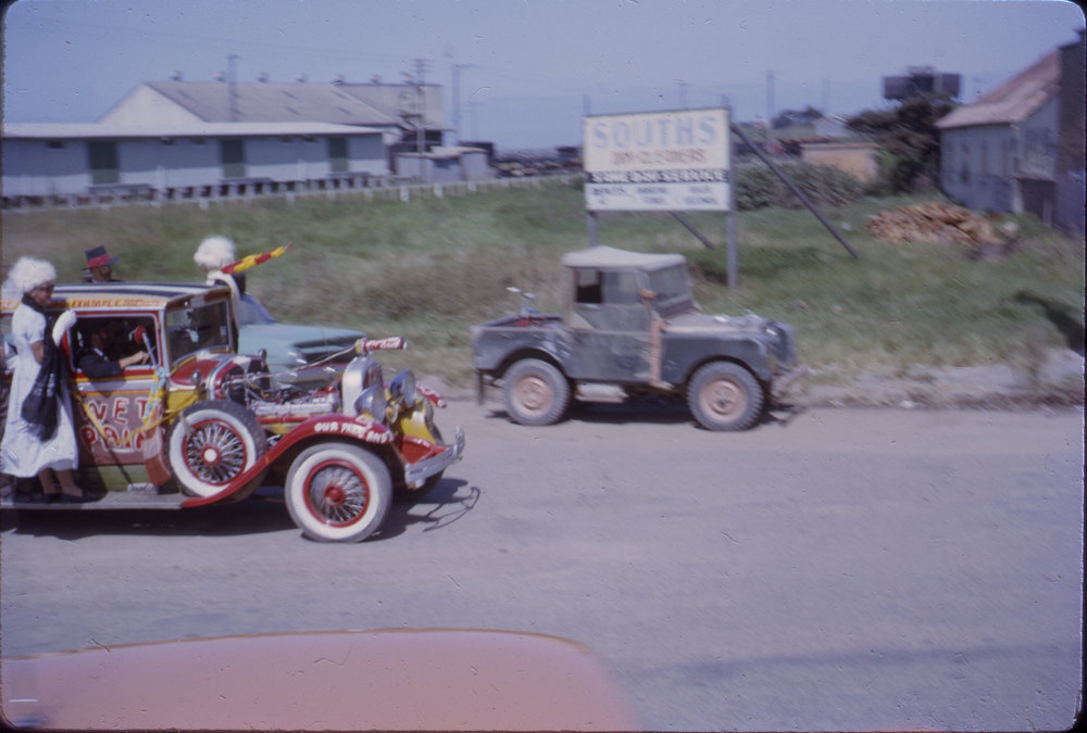 Decorated vintage car in street parade, Coffs Jetty, 1964