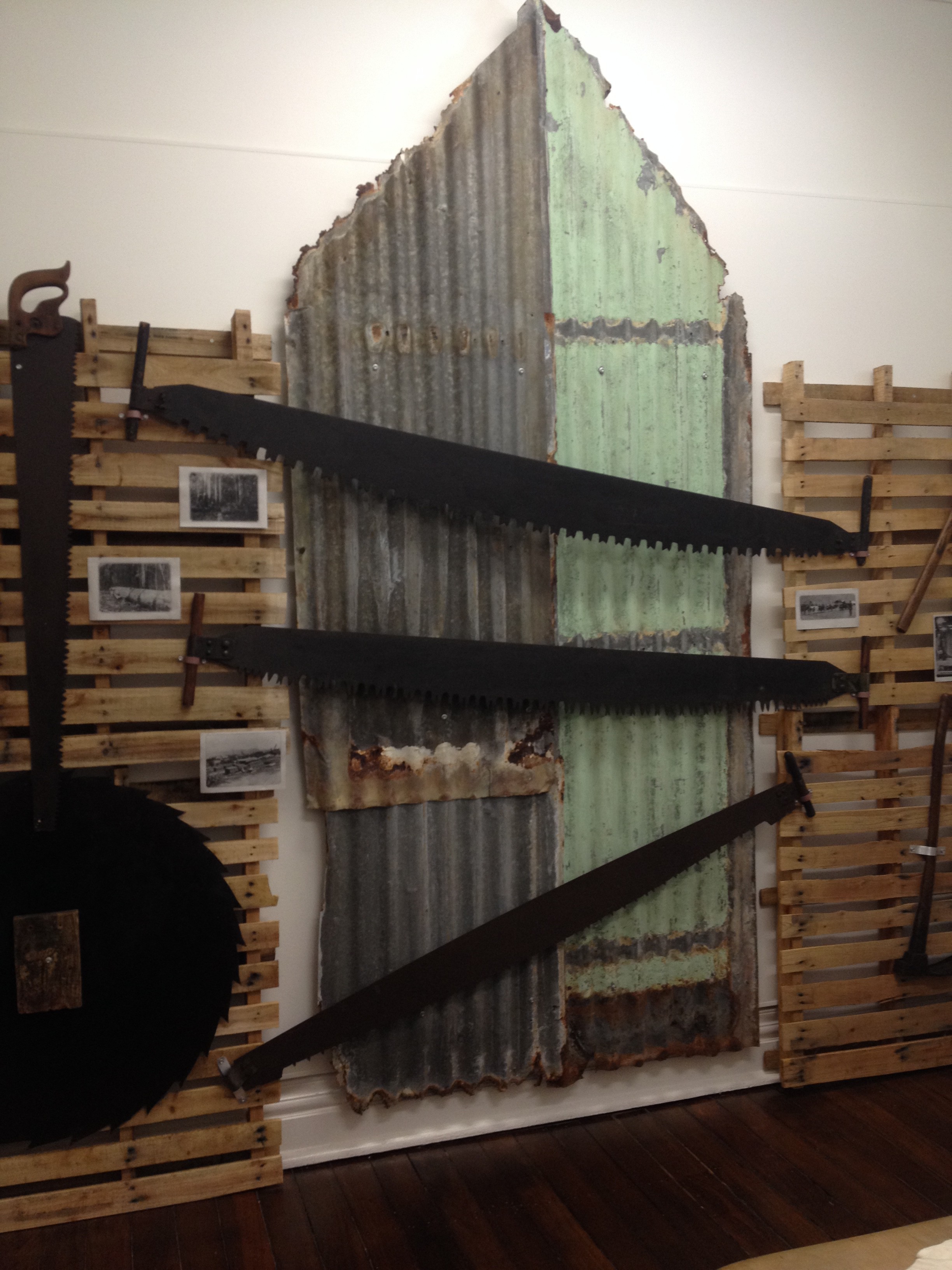 A circular saw blade (on left), and a variety of cross cut saws. Designed for two people, these large saws have filed teeth, set to cut across the grain of the timber, providing a knife action in the cutting. The top saw is called an “M tooth”, on account of the shape of the teeth.