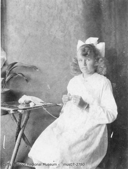 Alma Nelson doing needlework, 1915