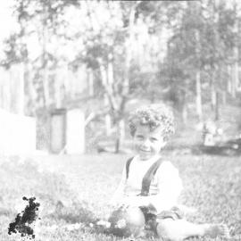 Toddler Jamie Hartley on the front lawn, 25 February 1923