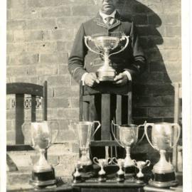 Bandmaster Jack Frame with prize cups won at the North Coast Bands' Association Contest, 1 March 1935 