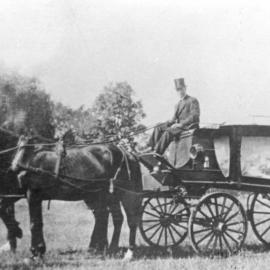 Harold Walker and undertaker C. H. Everingham with his horse-drawn hearse, 1920s