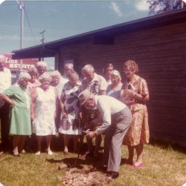 Mr Potts planting a gum tree at Coffs Harbour Regional Museum, c.1988