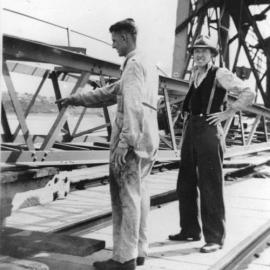 Public Works employees assembling crane 210 on Coffs Harbour jetty, mid 1940s