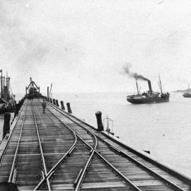 Jetty railway tracks and steamships, c. 1920