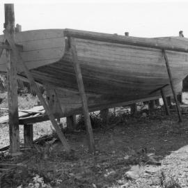 Harry Fanning building a launch, 1957