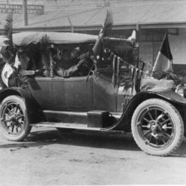 Decorated motor vehicle at Caldwell Bros' Jetty butchery, c. 1920