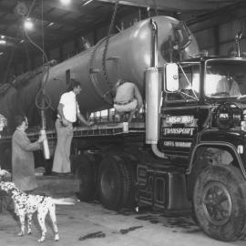 Heat exchanger being loaded onto a Lindsay Bros' truck at W. E. Smith's factory, 4 March 1976