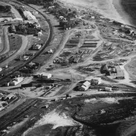 Stacks of timber on the foreshore, 1970 