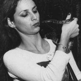 A black-headed python kisses a lady at Kumbaingeri Zoo, 1970