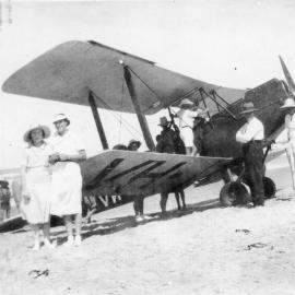 Biplane on Jetty Beach with spectators, 1937