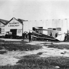 A Gypsy Moth aeroplane outside Harry Robinson's repair shop, 5 September 1928