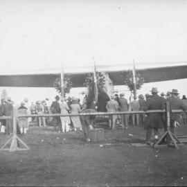 Charles Kingsford-Smith's aeroplane 'Southern Cross' with spectators, 9 June 1933 