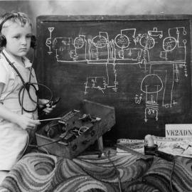 Portrait of Ian Hamey with circuit diagrams, 1949