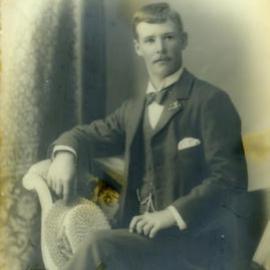 Portrait of a man with a straw boater hat, c. 1905