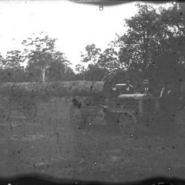 Log hauling demonstration with timber-wheeled tractor, 1912