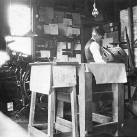 Working a printing press, c.1912