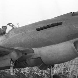 A pilot in the cockpit of an RAAF Tomahawk Boomerang fighter, c.1942