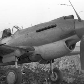 A pilot in the cockpit of an RAAF Tomahawk Boomerang fighter, c.1942 