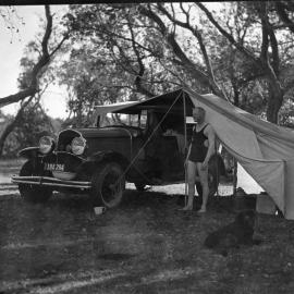 Algar Parish camping with his red setter, c.1930