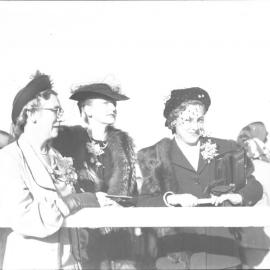 Three well dressed ladies at the Coffs Harbour Racing Club's inaugural meeting, 7 August 1948