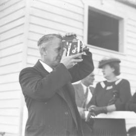 Jack Gerard filming at Coffs Harbour Racing Club's inaugural meeting, 7 August 1948