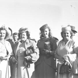 Four well dressed ladies at the Coffs Harbour Racing Club's inaugural meet, 7 August 1948