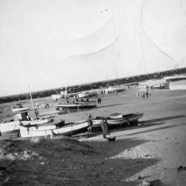 Fishing boats washed up on Jetty Beach after a cyclone, June 1950
