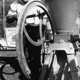 Doug Hoschke demonstrates how to use a corn cracker at the Orara Valley Fair, 10 June 1992 