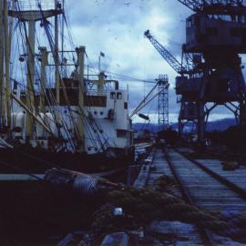 SS Kuranda being loaded at Coffs Harbour Jetty by crane, 1959 - 1960