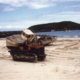 Fishing vessel washed up on Jetty Beach after a cyclone, 1956 - 1960