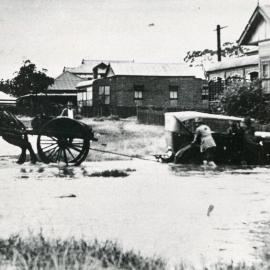 Dick Heskett rescuing Dr John Mulhearn's car from floodwaters, 1947 