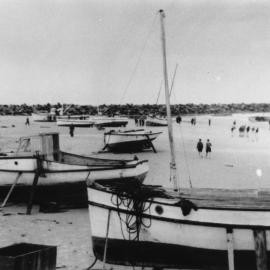 Wild weather drove small craft in the harbour ashore, August 1949