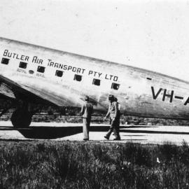 Butlers Air Transport's DC3 Royal Mail plane "Warrina" is met by a town bus