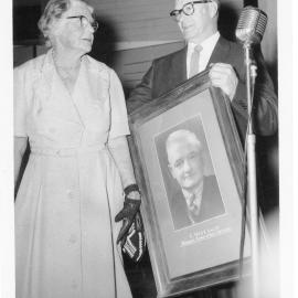 Lottie Vost and Charles Gilbey with Charles Vost's portrait, 13 October 1961