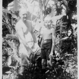 David and Robert Nicol standing on the small-cropping block, 1950s 