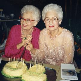 Adelie and Toni cutting their 70th Birthday cake at Sanctuary Cove Resort's Tree House Restaurant, 21 May 1989