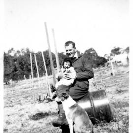 Jim and Brian Miller and Oscar the dog, 1950s