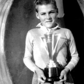 Hugh Nicol with the trophy won by Coffs Harbour High in a Kempsey knock-out football carnival, 1956