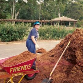 Alice Baker spreading the mulch at the North Coast Regional Botanic Garden