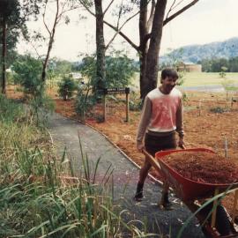 C. England spreading mulch in the rainforest at the North Coast Regional Botanic Garden