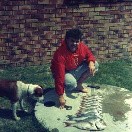 Brad Holmes at Minnie Water with a large catch of fish, 1973 