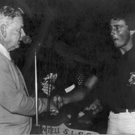 Life member Bill Woods presents the Clubman Award 1980-1981 to Brett Fields, 1981