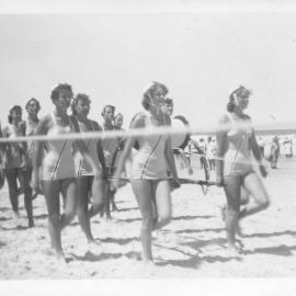 Sawtell Life Savers Surf Club ladies march past, 1958 