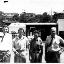 Cyril Nethery, Trevor O'Neill, Neville Budge and David Nicol at the Coffs Jetty Shell depot, 1950s