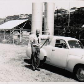 David Nicol and his Holden utility at the Coffs Jetty fuel depot, 1950s 