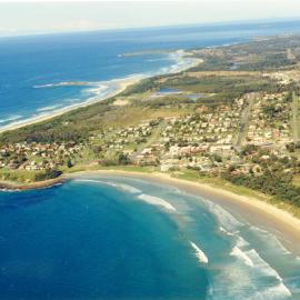 Aerial view over Woolgoolga CBD and Hearne's Lake, June 1994 